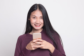 Young Asian woman with mobile phone.