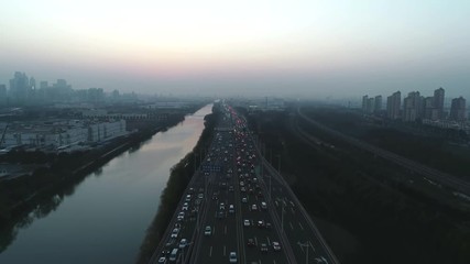 Aerial top view of highway interchange on the sunset. Aerial top view of road junction from above, automobile traffic and jam of many cars, useful for engineering, industrial, transportation concept