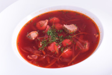 Borsch - traditional Ukrainian and Russian beetroot soup on white background.