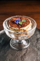 Tiramisu in glass cup is a coffee-flavoured Italian dessert. It is made of ladyfingers dipped in coffee, layered with a whipped mixture of eggs, sugar, and mascarpone cheese, flavoured with cocoa.