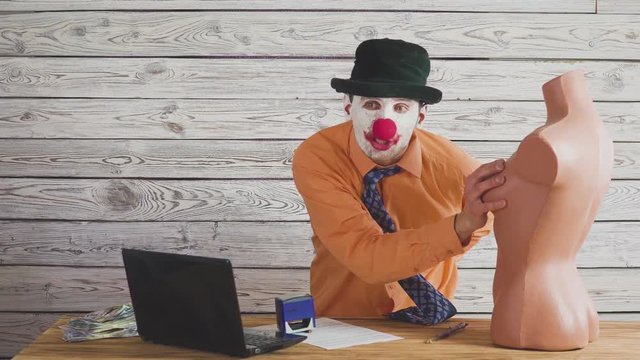 Funny clown boss flirts with the secretary dummy. Stupid, sexually boss.