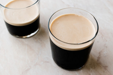 Frothy Cold Brew Nitro Coffee with Beans Ready to Drink.
