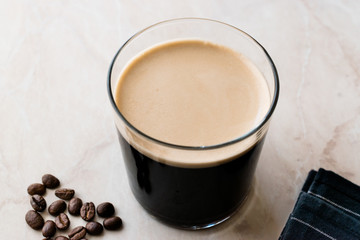 Frothy Cold Brew Nitro Coffee with Beans Ready to Drink.