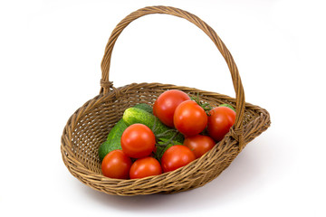 basket with fresh vegetables on white background