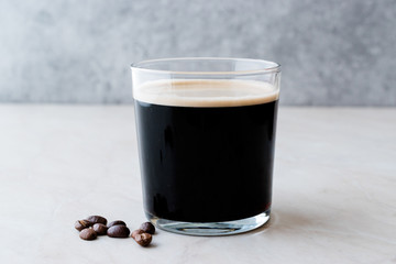 Frothy Cold Brew Nitro Coffee with Beans Ready to Drink.