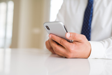 Close up of business man hands using smarpthone