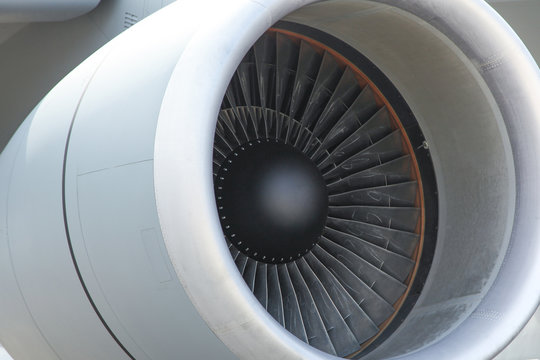 Gray turbine aircraft in full frame. Airplane's jet engine closeup. fan blades are inside a jet engine. 