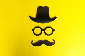 Booth props mustache, hat, glasses isolated on yellow background. Birthday and Party Set