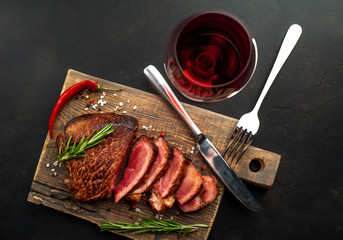 Grilled beef steak with red wine, herbs and spices. View from above
