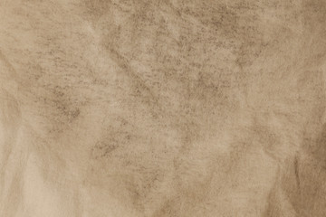 Brown textured flat paper with natural geometric shape.