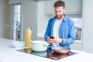 Handsome man cooking pasta at home