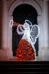 Christmas angel decorated with lights and ornaments, shining in the romantic atmosphere, Dubrovnik, Croatia 