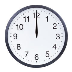 Round office clock showing twelve o'clock isolated on white background. Midnight or midday clock...