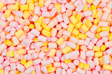 Marshmallow. Background of pink and yellow colorful mini marshmallows.