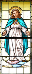 Fototapeta na wymiar Immaculate Heart of Mary, stained glass window in the parish church of the Holy Trinity in Krasic, Croatia