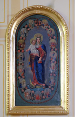 Fototapeta na wymiar Virgin Mary Queen of the Holy Rosary altarpiece in parish church of the Holy Trinity in Krasic, Croatia 