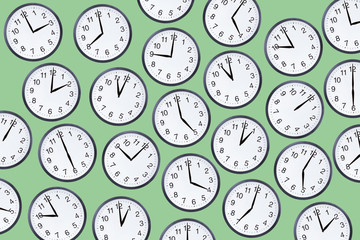 Set of office clocks on green background