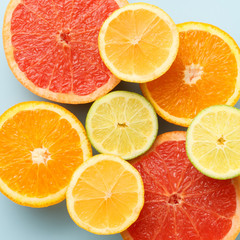 Top view of sliced citrus fruits colorful background