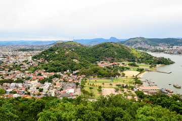 Aerial view of the beautiful city of Vitoria, Espirito Santo, Brazil and its wide bay. The city developed with its high buildings growing on the hills and into the local greenery