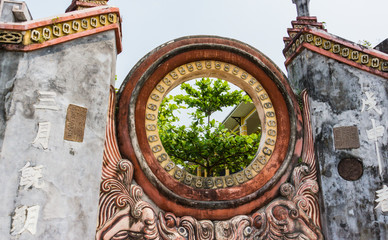 Fototapeta na wymiar open circle on the Ba Mu Temple Gate in historic old town of Hoi An