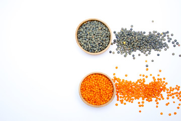 Lentil in a wooden plate isolated on white background, concept of healthy eating. Copy space