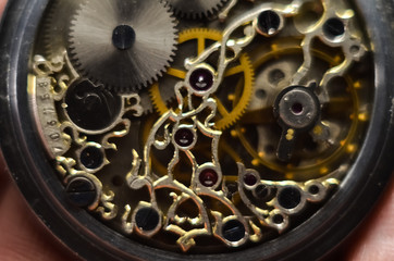 Skeleton hours. Antique antique clockwork, jewelry engraving. mechanical pocket watch close-up,...