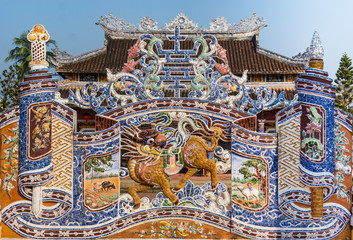 elaborate ceramic entrance to temple with inlaid mosaic ceramic pieces creating pattern
