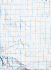 One crumpled squared blank paper sheet of a notebook (background)