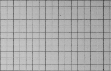 Blank paper sheet of a notebook. Grid. Grey. Background