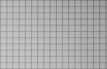 Blank paper sheet of a notebook. Grid. Grey. Background