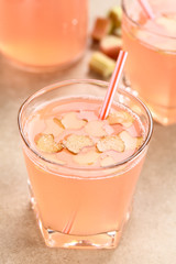 Refreshing homemade rhubarb juice, thin slices of rhubarb on top (Selective Focus, Focus one third into the juice)