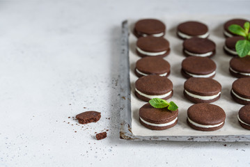Chocolate  sandwich  cookies on a baking sheet
