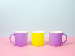 The new cups are bright colors - purple and yellow.