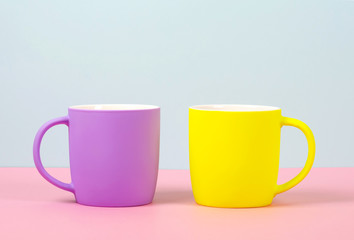 The new cups are bright colors - purple and yellow.