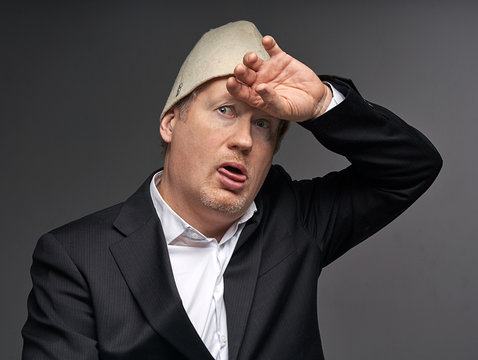 portrait of a businessman in hat bathhouse  tire