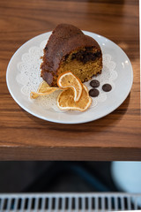 A slice of orange and chocolate pound cake