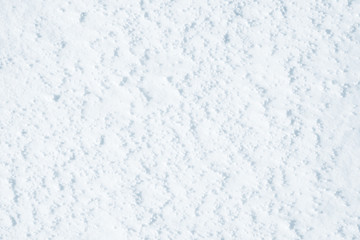 Fresh snow background texture. Winter background with snowflakes and snow mounds. Snow lumps.
