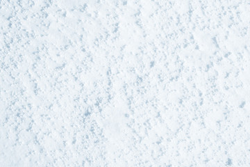 Fresh snow background texture. Winter background with snowflakes and snow mounds. Snow lumps.