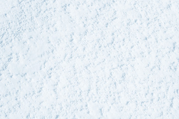 Fresh snow background texture. Winter background with snowflakes and snow mounds. Snow lumps.