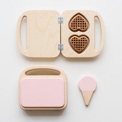 Wooden waffle makers. Waldorf toys  on white background