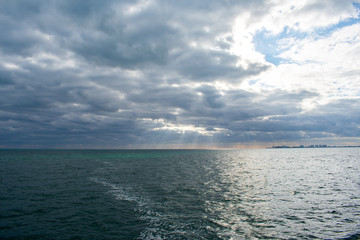View of Caribbean sea against cloudy sky. 