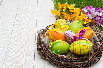 Easter decoration with eggs on a wooden background.