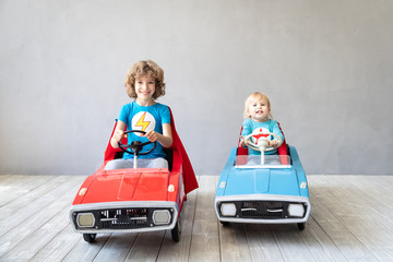 Fototapeta premium Children superheroes playing at home