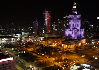 Fototapeta na wymiar Warsaw, Poland. Aerial view center of the city in the night. Palace of Culture and Science and business skyscrapers
