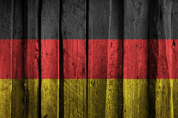 German flag on background of old wooden planks.