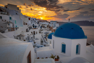 Santorini greece famous Oia in sunset time golden hour 