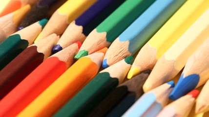 Colored pencils close up in macro photography. Art set of pencils with free space.