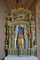 Fototapeta na wymiar Virgin Mary with baby Jesus, statue on the altar in Chapel of Saint Vitus in Komor Zacretski, Croatia