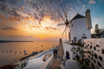 Santorini greece famous Oia in sunset time golden hour 