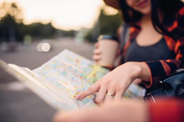 Tourists study the map of city attractions